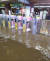 23일 오후 부산 도시철도 지하도에 쏟아진 폭우로 출입구가 잠겨있다. 뉴스1