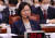 추미애 법무부 장관이 27일 오후 서울 여의도 국회에서 열린 법제사법위원회 전체회의에 출석해 의원들의 아들 병역 관련 자료제출과 관련한 의사진행 발언을 경청하며 미소를 짓고 있다. 뉴스1
