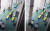 5일 미상의 남성이 KBS 라디오 스튜디오 유리창을 곡괭이로 내려친 뒤 KBS 시큐리티 직원들을 바라보는 모습 [동영상 캡쳐]