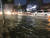 7일 오후 부산 해운대구 우동 한 도로에 물이 차올라 차량이 서행하고 있다. 부산 경찰청 제공=연합뉴스