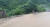 최고 200㎜가 넘는 폭우가 내린 3일 오전 강원 철원군 육단리의 침수 도로와 인접한 군부대 담장이 무너져 있다. [연합뉴스]