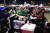 미국 델라웨어주 윌밍턴에서 열린 민주당 전당대회 마지막 날인 20일 지지자들이 야외 주차장에 마련된 대형 화면에서 조 바이든 대통령 후보의 연설을 듣고 있다. [AP=연합뉴스]
