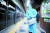 지난 6월 17일 오후 신종 코로나바이러스 감염증(코로나19) 확진자가 발생한 서울 지하철 2호선 시청역 승강장에서 관계자가 방역하고 있다. [연합뉴스]