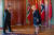 유럽 순방에 나선 왕이 중국 국무위원 겸 외교부장이 지난달 27일 노르웨이 총리 에르나 솔베르그와 코로나를 의식한 듯 멀리 떨어져서 가슴에 손을 얹는 방식의 인사를 나누고 있다. [AP=연합뉴스]