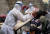 사진은 지난 7월 코로나19가 확산한 신장위구르자치구의 우루무치시에서 방호복을 입은 의료진이 주민을 대상으로 핵산검사를 하고 있는 모습. 로이터=연합뉴스