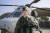 해병대가 해병대 최초의 여군 헬기 조종사를 양성했다고 1일 밝혔다.   사진은 해병대 여군 최초로 헬기 조종사 임무를 수행하는 조상아 대위가 해병대1사단 제1항공대대 마린온 앞에서 기념사진을 찍는 모습. 연합뉴스