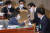 추미애 법무부 장관(왼쪽)이 11일 국회에서 열린 예산결산특별위원회 전체회의에 출석해 정성호 예결위원장과 주먹 인사를 하고 있다. 오종택 기자