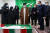 이란의 사법부 수장인 아야톨라 에브라힘 라이시(가운데)가 28일 피살당한 이란의 핵 과학자 모센 파크리자데의 시신 앞에서 조문하고 있다. [AP=연합뉴스]