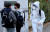 3일 오전 인천의 한 고등학교 앞에서 한 수험생이 방호복을 입고 고사장으로 향하고 있다. 뉴스1