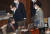 추미애 법무부 장관(오른쪽)이 2일 국회 본회의에서 내년도 예산안 통과된 뒤 정세균 국무총리(왼쪽)을 따라 회의장을 나서고 있다. 연합뉴스