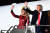 지난달 5일(현지시간) 도널드 트럼프 미국 대통령과 영부인 멜라니아 여사가 조지아주 발도스타 공항에서 에어포스원에 타기 전 지지자들에게 인사를 하고 있다. [AFP=연합뉴스]