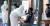 지난달 24일 충남 천안시 백석동 산업단지에 설치된 코로나19 선별진료소에서 의료진이 외국인 근로자들을 대상으로 검사를 진행하고 있다. 뉴스1