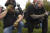 지난해 9월 미국 오리건 포틀랜드에서 프레드 페리 제품으로 보이는 티셔츠를 입고 있는 프라우드 보이즈 회원들이 집회에 앞서 기도를 하고 있다. [AP=연합뉴스]