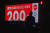 4일 일본 도쿄의 한 시민이 도쿄올림픽 D-200을 알리는 대형 스크린 옆을 지나고 있다. 일본 정부는 도쿄올림픽 강행을 외치지만, 안팎의 시선은 싸늘하다. [AP=연합뉴스]