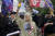 큐어넌의 상징인 Q가 그려진 티셔츠를 입은 한 여성이 지난 6일(현지시간) 워싱턴 DC에서 시위에 참여하고 있다. [AP=연합뉴스]