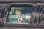 플로리다에 도착한 트럼프 대통령이 자신 소유의 마라라고 리조트로 행하는 자동차 안에서 지지자들을 향해 엄지를 치켜들고 있다. AP=연합뉴스