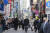 지난달 27일 마스크를 쓴 시민들이 도쿄 시내를 지나고 있다. [AP=연합뉴스]
