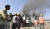 지난달 21일 SII 본사가 자리 잡은 인도 서부 푸네에서 화재가 발생해 연기가 나고 있다. EPA=연합뉴스 