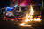 27일 밤 시위가 벌어진 바르셀로나에서 경찰차가 불타고 있다. AP=연합뉴스