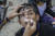6일(현지시간) 미얀마 최대도시 양곤에서 반 쿠데타 시위 참가자가 경찰의 최루탄 공격을 받고 의료 처치를 받고 있다. [EPA=연합뉴스]