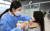 17일 오전 충남 천안시 서북구 실내테니스장에 마련된 예방접종센터에서 실시된 지역 예방접종센터 모의훈련에서 접종대상자들이 백신을 접종받고 있다. 사진공동취재단