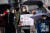 시리아 내전이 10주년을 맞기 하루 전인 지난 3월 14일 독일 베를린의 연방의사당 주변에서 한 시리아 난민이 '10년간의 학살, 시리아인에게 자유와 정의를'이라는 구호와 실종된 가족 사진읋 시위를 벌이고 있다. AP=연합뉴스 