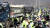지난달 25일 경북 성주 사드 기지 인근 소성리 마을회관 앞에서 기지로 공사 장비·자재를 실은 차들이 경찰의 삼엄한 경비 속에 들어가고 있다. 연합뉴스