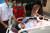 지난 27일 양곤에서 군부에 대항하는 시위에 참가하던 중 부상당한 남성이 병원으로 이송된 모습 [AP=연합뉴스]