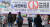 4·7 재보궐선거 사전투표를 하루 앞둔 1일 오후 서울 성북구의 한 거리에 설치된 사전투표 홍보 현수막 아래로 시민들이 지나가고 있다. 뉴스1