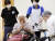 12일 오전 도쿄의 한 백신접종 센터에서 코로나19 백신 접종을 앞둔 시민이 무사접종을 기원하고 있다. [로이터=연합뉴스] 