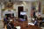 조 바이든 미국 대통령(가운데)이 지난 12일(현지시간) 워싱턴 백악관 루스벨트룸에서 ‘반도체 서밋’ 화상회의에 참석해 발언하고 있다. 책상 왼쪽에 반도체 웨이퍼가 놓였다. [EPA]
