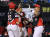 KIA 최형우(오른쪽)가 프로 통산 2000번째 안타를 연속 홈런으로 장식한 뒤 홈에서 축하를 받고 있다. [연합뉴스] 