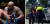 세계 최대 종합격투기 UFC 헤비급 랭킹 2위인 데릭 루이스(왼쪽)의 차량을 훔치려고 시도한 범인이 경찰에 연행되고 있다. 루이스에게 발각된 범인은 그에게 맞아 KO를 당했다. 범인은 루이스에게 맞은 뒤 머리에 붕대를 감은 것으로 보인다. [MMA 홈페이지·인스타그램 캡처]