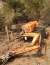 지난달 11일 충남 서산시 지곡면에서 벌목 작업을 하던 굴착기가 전도되어 옆으로 넘어져 있다. 연합뉴스(서산소방서 제공)