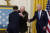 문재인 대통령은 조 바이든 미국 대통령(오른쪽)으로부터 훈장을 받은 한국전 참전 용사 랠프 퍼킷 주니어 예비역 대령(가운데)을 포옹했다. [AP=연합뉴스]