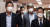박범계 법무부 장관과 이인영(왼쪽) 통일부 장관이 8일 오전 서울 종로구 정부서울청사에서 영상으로 열린 국무회의에 참석하고 있다. 가운데는 한상혁 방송통신위원장. 뉴시스