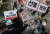 지난 2월 17일 오후 서울 중구 명동거리에서 아르바이트 노동조합이 연 기자회견에서 참가자들이 4차 재난지원금 선별 지급에 반대하는 퍼포먼스를 하고 있다. [연합뉴스] 