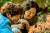 영화 '빛나는 순간'에서 주연 (오른쪽부터) 고두심·지현우가 숲속 상사화를 바라보는 장면이다. [사진 명필름]
