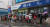 지난 7일 오전 경북 포항시 북구 수협장성지점 앞에서 시민들이 포항사랑상품권을 구입하기 위해 장맛비를 맞으며 줄을 서서 기다리고 있다. 뉴스1
