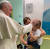 프란치스코 교황이 13일 자신이 입원중인 로마의 제멜리 병원 소아암 병동을 방문해 어린이 암환자의 머리를 쓰다듬고 있다. AFP=연합뉴스