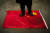 터키에 거주하는 한 위구르 공동체 관계자가 지난 3월 왕이 중국 외교부장의 터키 방문 때 중국 국기인 오성홍기를 밟는 모습으로 시위에 나서고 있다. [AP=뉴시스]