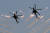 러시아 공격헬기 곡예비행단 '골든 이글'이 20일 에어쇼에서 축하 곡예비행을 하고 있다. TASS=연합뉴스