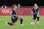 21일 일본 삿포로 돔에서 열린 도쿄 올림픽 여자축구 E조 영국-칠레 1차전에서 영국의 조지아 스탠웨이(완쪽)와 키이라 월시가 선수가 인종차별에 항의하기 위한 무릎 꿇기 세리머니를 하고 있다. [AFP=연합뉴스] 