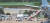 코로나19 집단감염이 발생한 청해부대 34진 301명 전원이 20일 오후 성남 서울공항으로 귀국했다. 이날 한 장병(원 안)이 음압 이송 카트에 실려 이송되고 있다. [연합뉴스]
