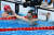 26일 일본 도쿄 아쿠아틱스 센터에서 열린 남자 자유형 200m 준결승에 출전한 한국 황선우가 경기를 마친 뒤 기록을 보고 있다. 올림픽사진공동취재단