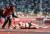 1일 오전 올림픽 스타디움에서 여자 3000m 장애물 1라운드 경기를 마친 뒤 덴마크 선수를 경기 관계자가 살펴보고 있다. EPA=연합뉴스