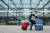 한 여성이 영국 런던의 개트윅 공항에서 짐을 나르고 있다. [AP=연합뉴스]