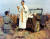 한국전쟁에 참전해 아군과 적군을 가리지 않고 박애를 실천한 ‘한국전의 예수’ 에밀 카폰 신부(오른쪽)가 한국전 당시 미사를 집전하는 모습. [미국 캔자스주 위치토 교구 홈페이지 캡처]