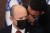 나프탈리 베넷 이스라엘 총리가 1일(현지시각) 각료회의에 참석해 귀엣말을 듣고 있다. [EPA=연합뉴스] 