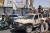 아프간 남부 칸다하르 주를 점령한 탈레반 반군 전사들이 13일(현지시간) 정부군 차량을 몰고 거리를 달리고 있다. AFP=연합뉴스